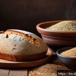 유기농 제빵 재료 - A rustic kitchen scene featuring a freshly baked organic whole wheat bread loaf on a wooden cutting ...